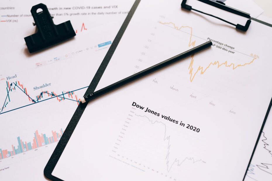 Stock market graph showing a downturn, symbolizing a liquidity squeeze, with an IPO document in the background.