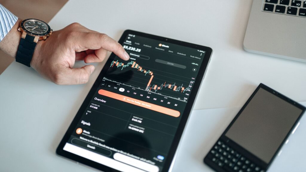 Traditional finance executive looking at a digital asset chart with blockchain symbols