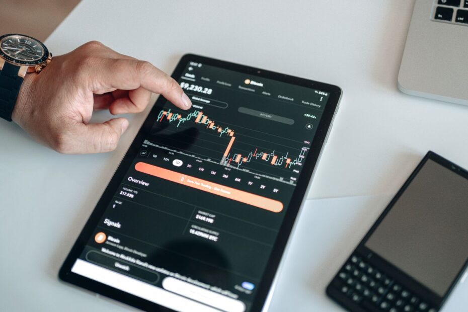 Traditional finance executive looking at a digital asset chart with blockchain symbols
