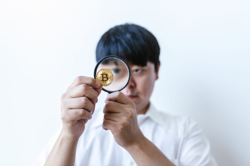 Artificial intelligence tools analyzing cryptocurrency data with a magnifying glass over a blockchain network