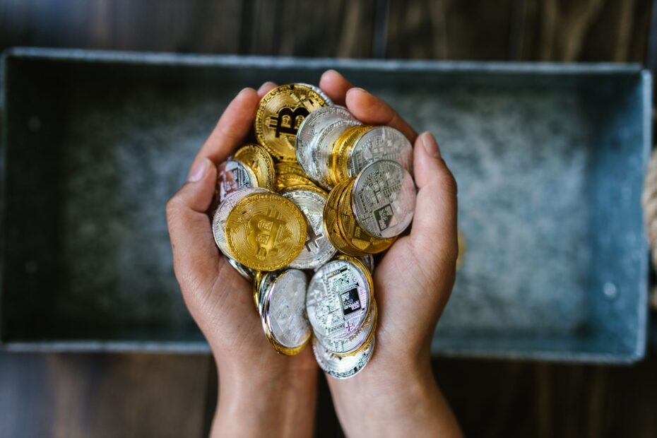 AI robot interacting with digital cryptocurrency coins, symbolizing the convergence of artificial intelligence and digital assets.